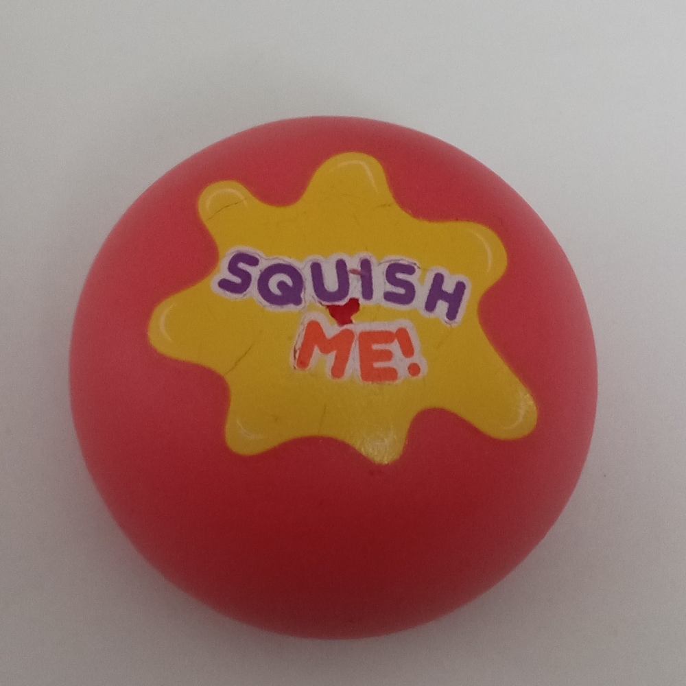 Free with Purchase:  Squish Me Red Stress Ball